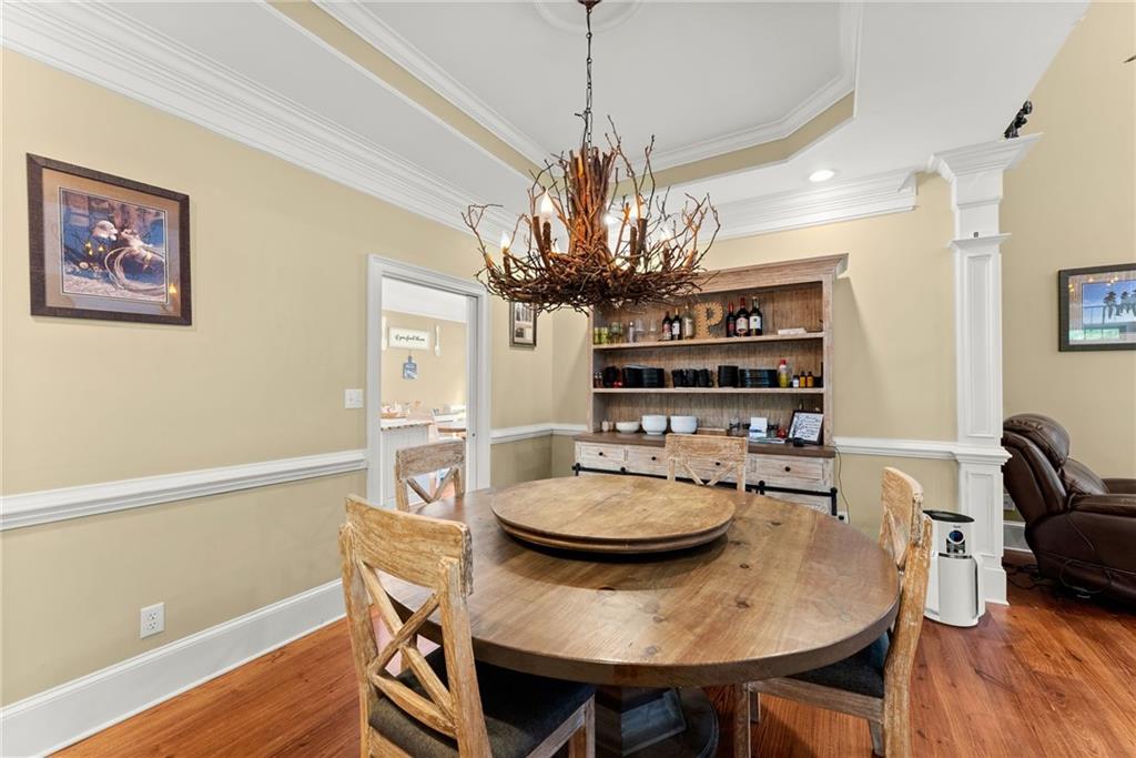 2832 B B Wilson Road Commerce, GA 30529 - Photo 11 of 96 a view of a dining room with furniture and wooden floor