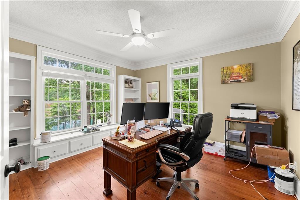 2832 B B Wilson Road Commerce, GA 30529 - Photo 19 of 96 a view of a workspace with furniture and a window