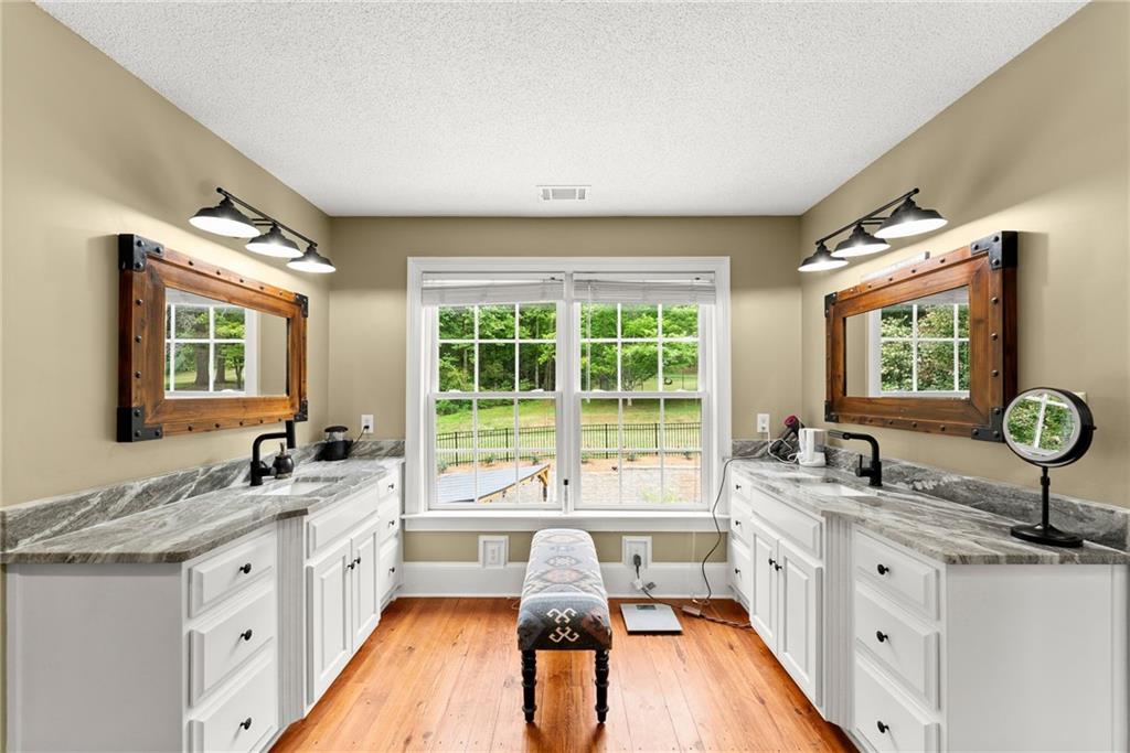2832 B B Wilson Road Commerce, GA 30529 - Photo 23 of 96 a kitchen with a sink stove and cabinets