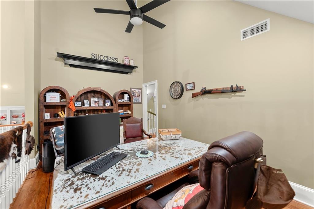 2832 B B Wilson Road Commerce, GA 30529 - Photo 35 of 96 a living room with a bed furniture and a window