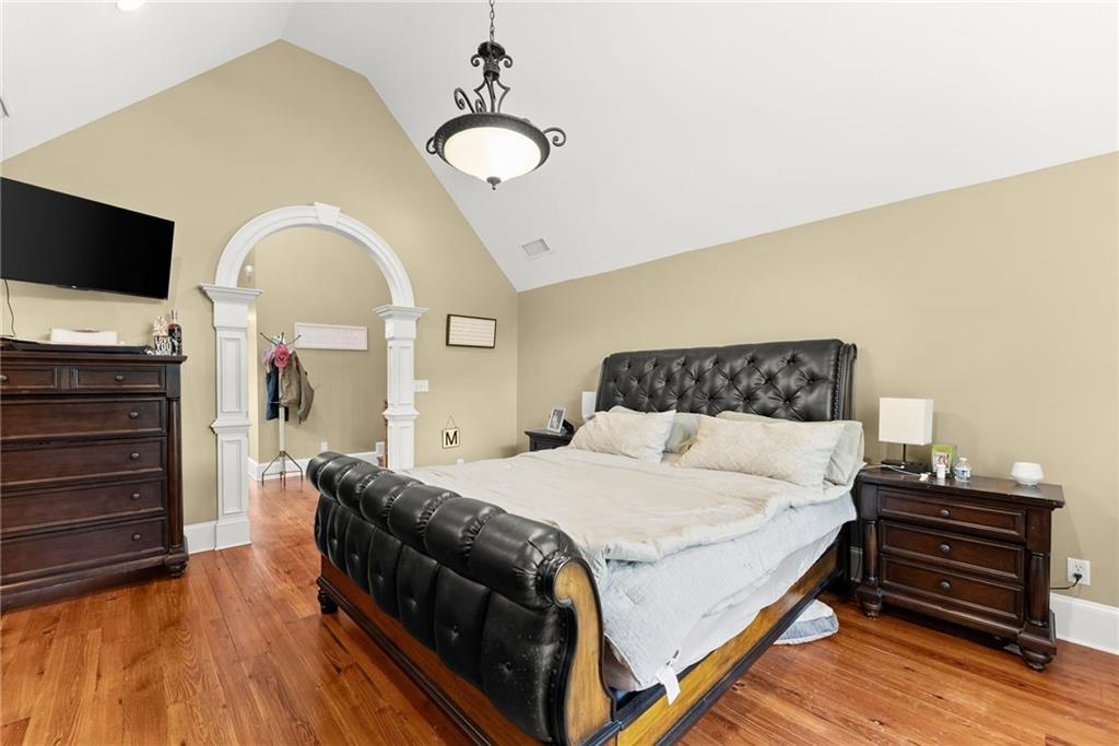2832 B B Wilson Road Commerce, GA 30529 - Photo 37 of 96 a bedroom with a bed and wooden floor