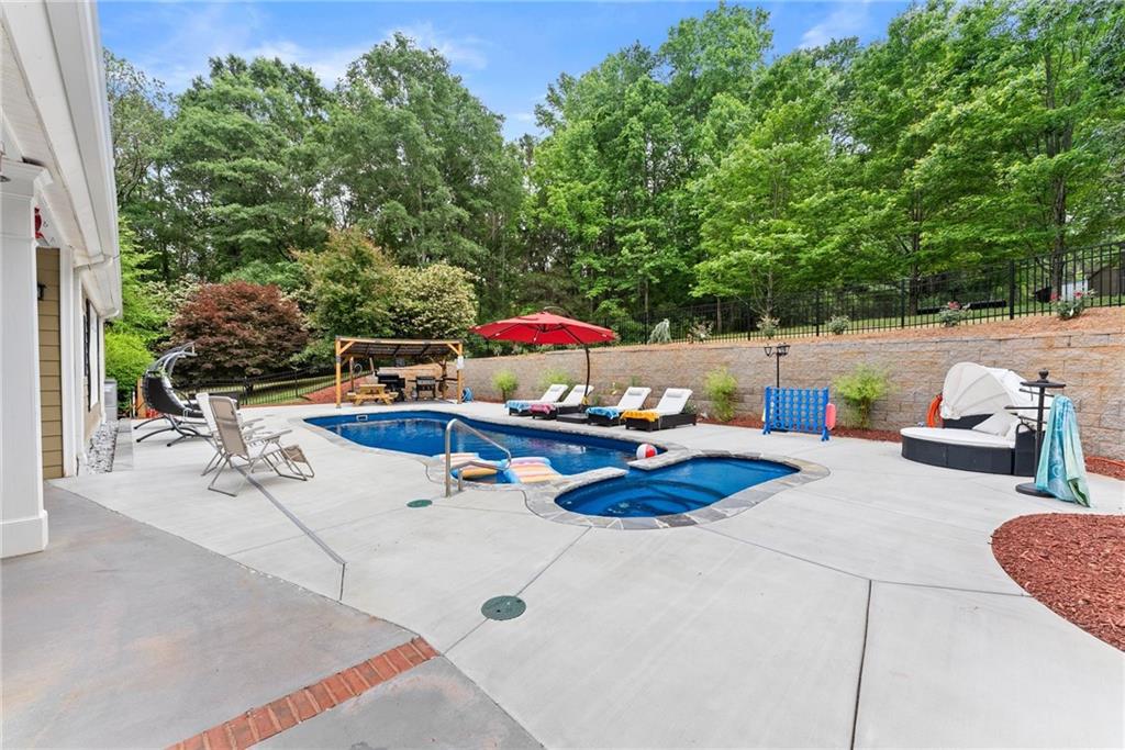 2832 B B Wilson Road Commerce, GA 30529 - Photo 64 of 96 a view of backyard with swimming pool and seating space