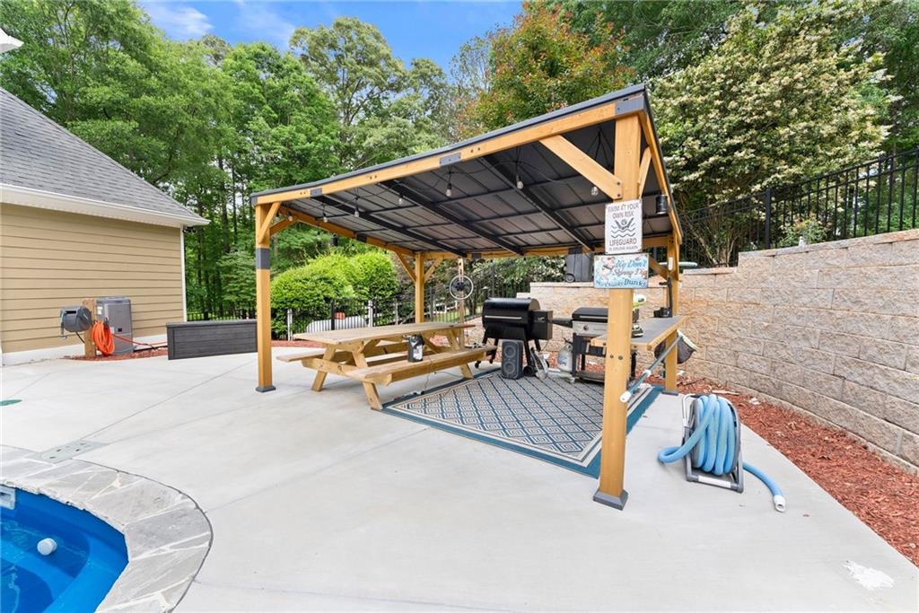 2832 B B Wilson Road Commerce, GA 30529 - Photo 67 of 96 a view of backyard with a patio and a garden