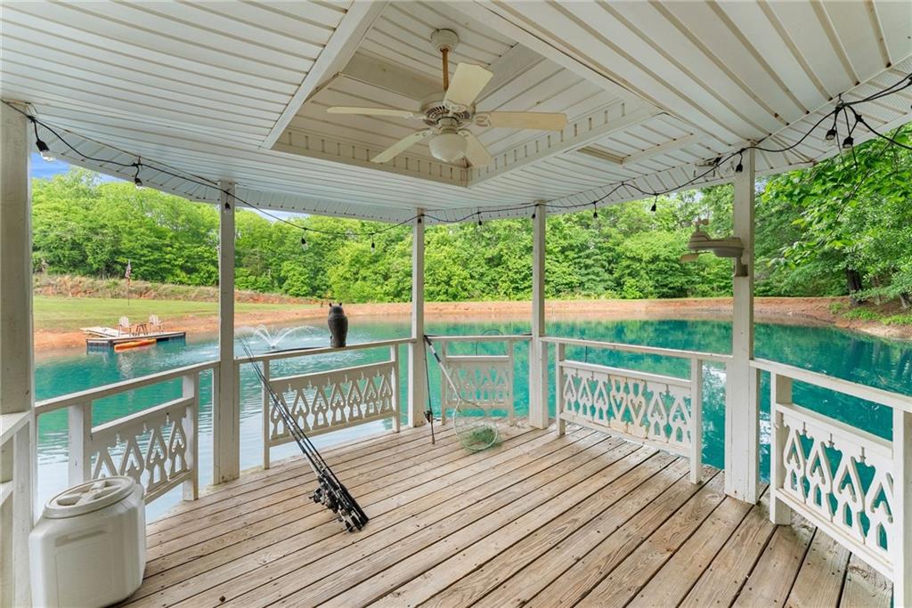 2832 B B Wilson Road Commerce, GA 30529 - Photo 80 of 96 a view of a deck with wooden floor and outdoor seating