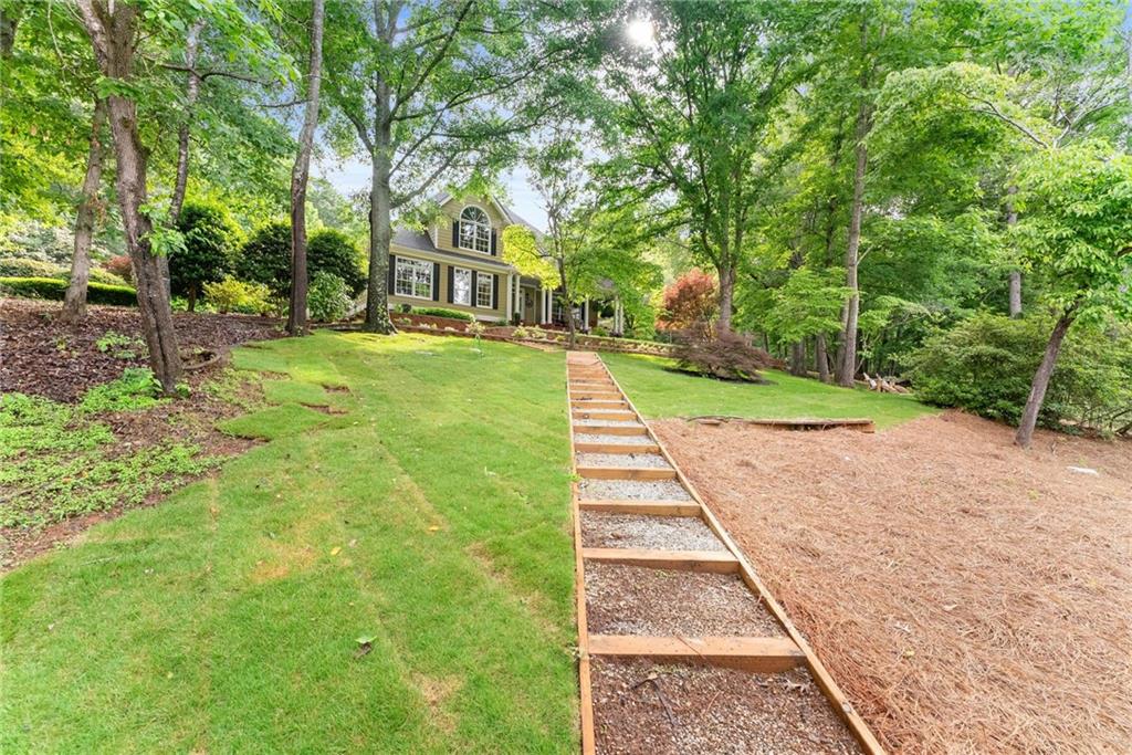 2832 B B Wilson Road Commerce, GA 30529 - Photo 81 of 96 a view of a yard with plants and trees