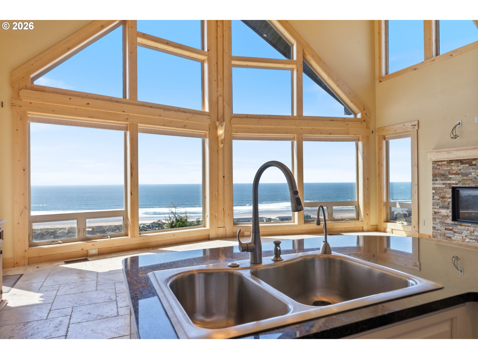 367 South Longview Loop Rockaway Beach, OR 97136 - Photo 13 of 48 a kitchen view with a sink and chandelier