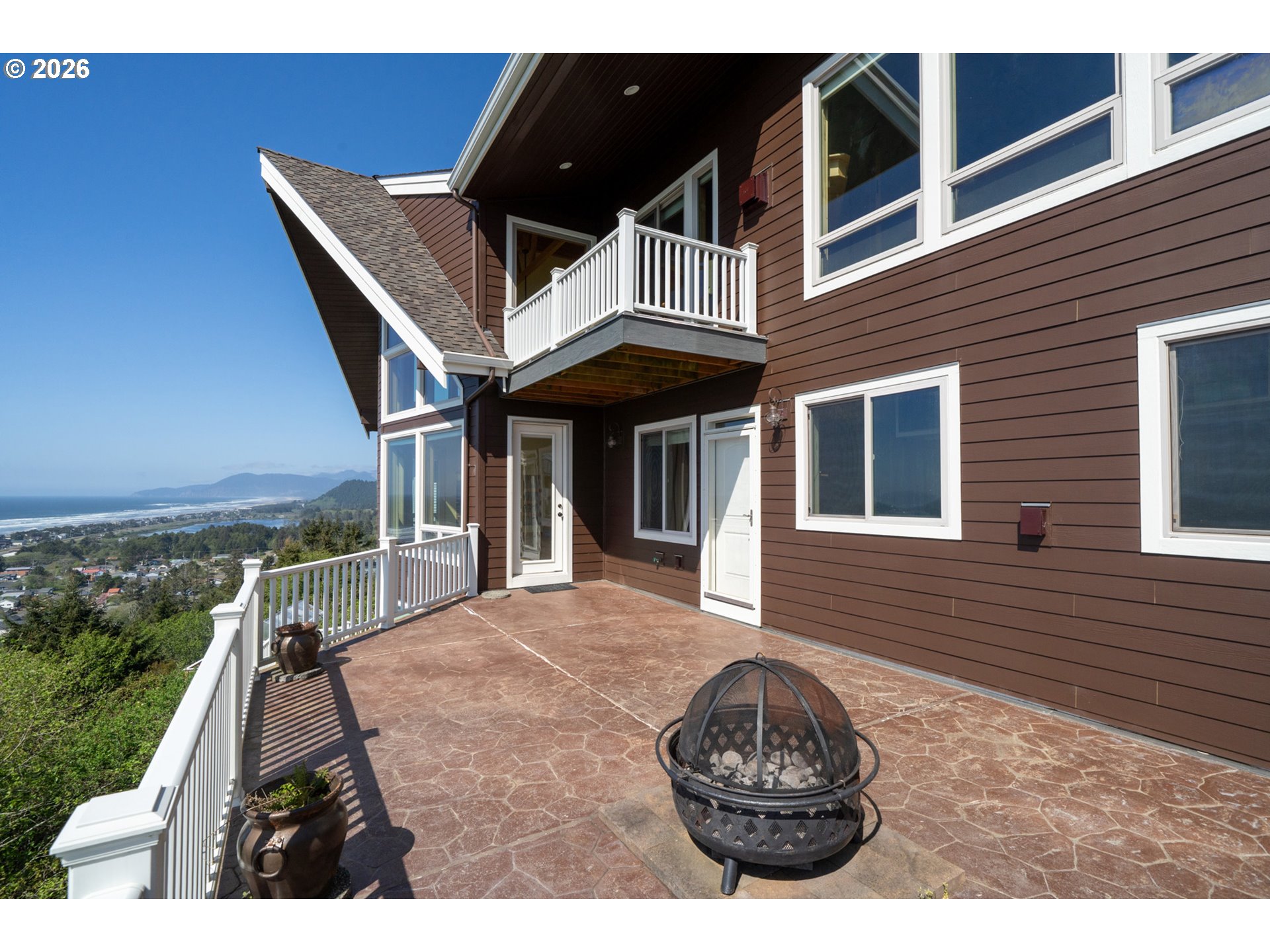 367 South Longview Loop Rockaway Beach, OR 97136 - Photo 16 of 48 a front view of a house with a garden