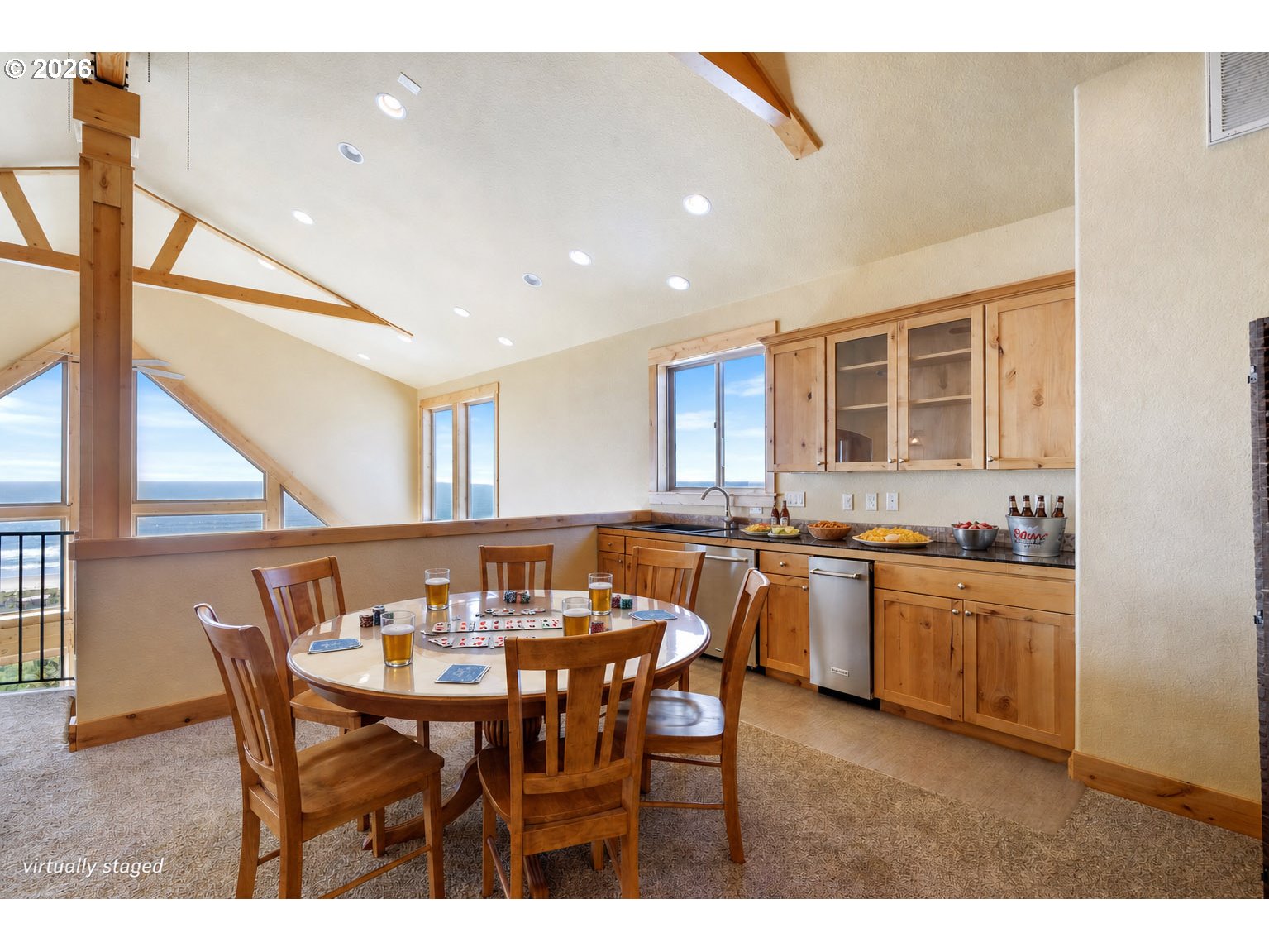 367 South Longview Loop Rockaway Beach, OR 97136 - Photo 19 of 48 a kitchen with a dining table chairs and stove