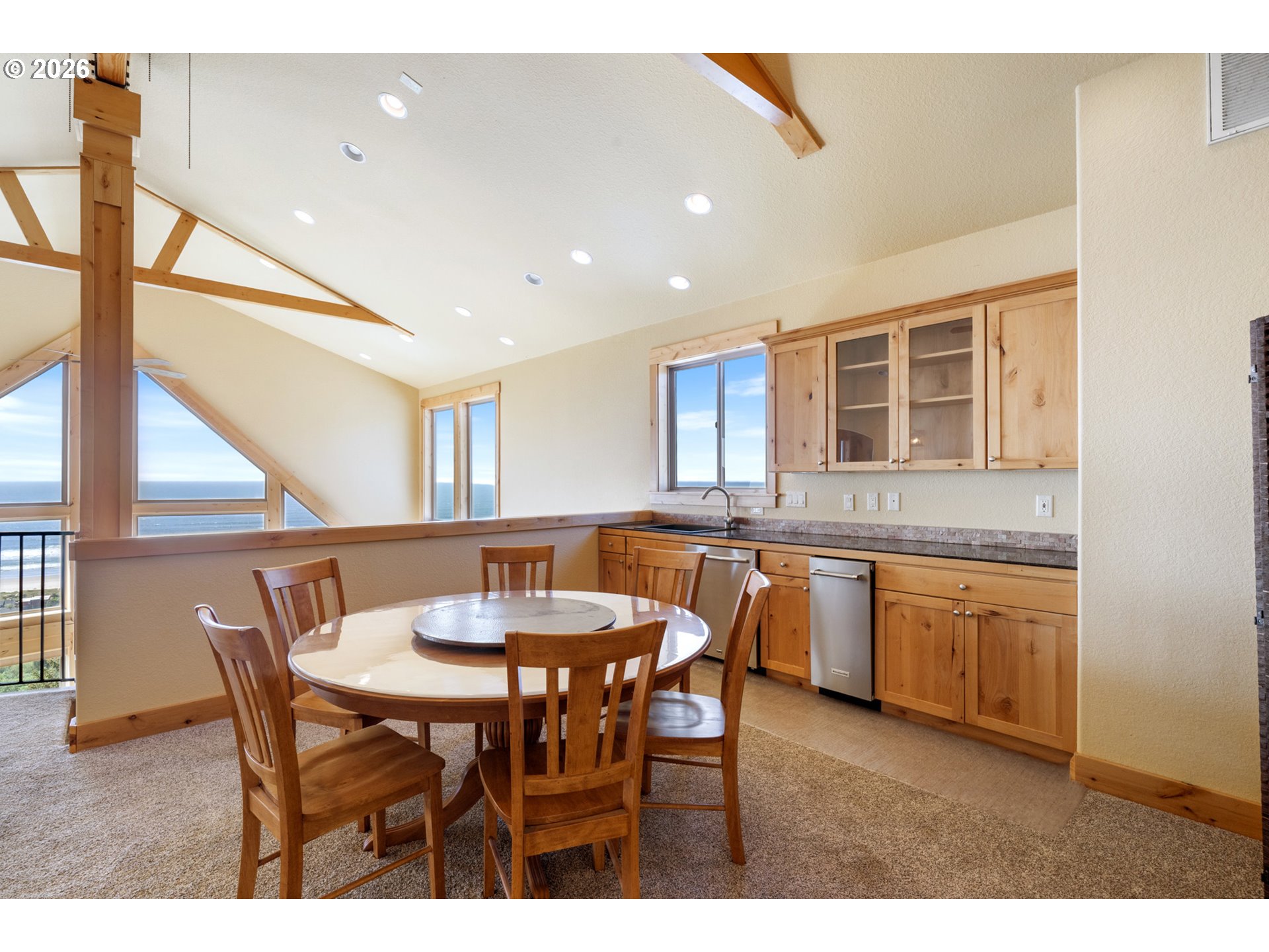 367 South Longview Loop Rockaway Beach, OR 97136 - Photo 20 of 48 a kitchen with a table and chairs in it
