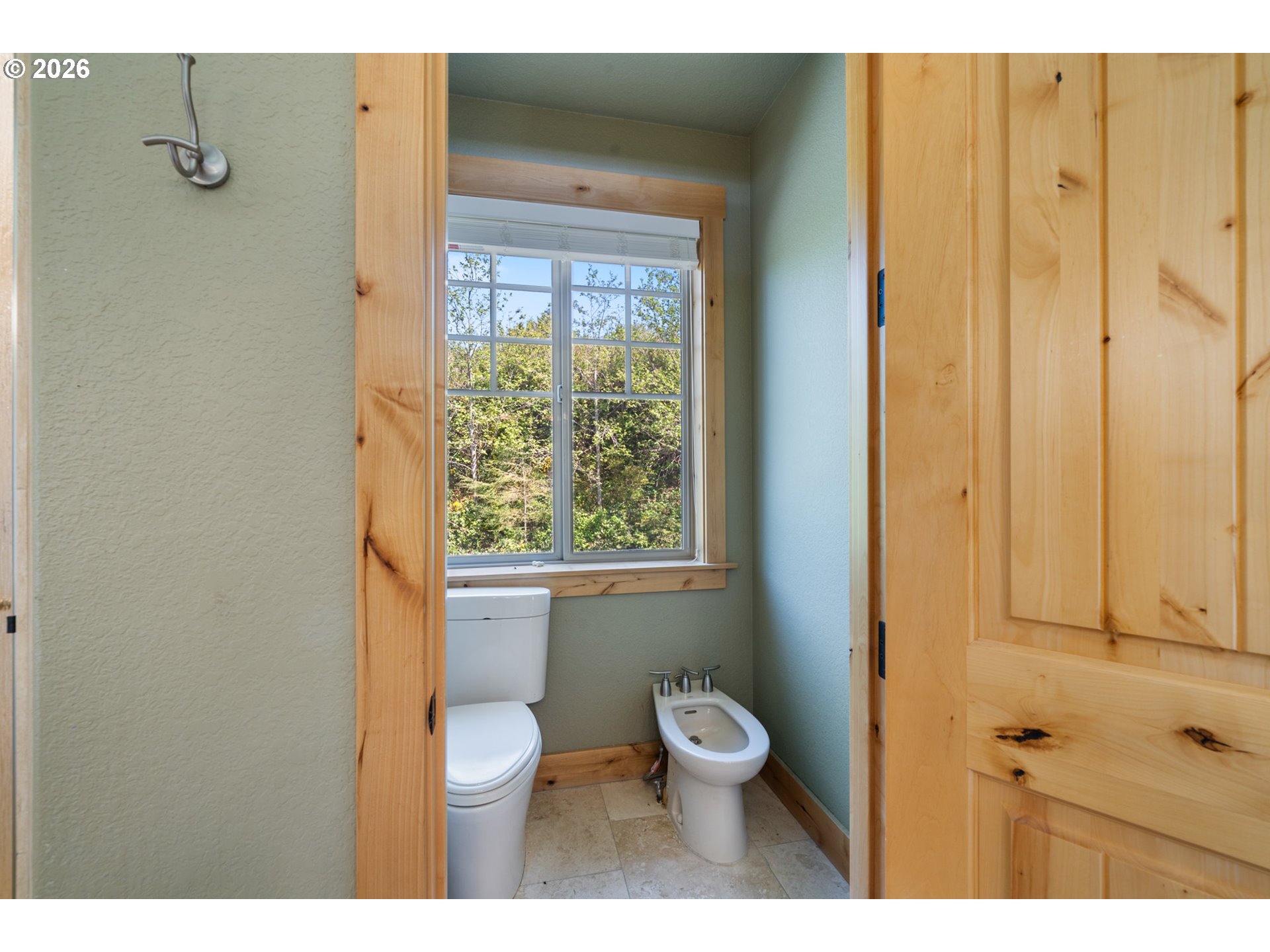 367 South Longview Loop Rockaway Beach, OR 97136 - Photo 31 of 48 a bathroom with a toilet a sink and a shower