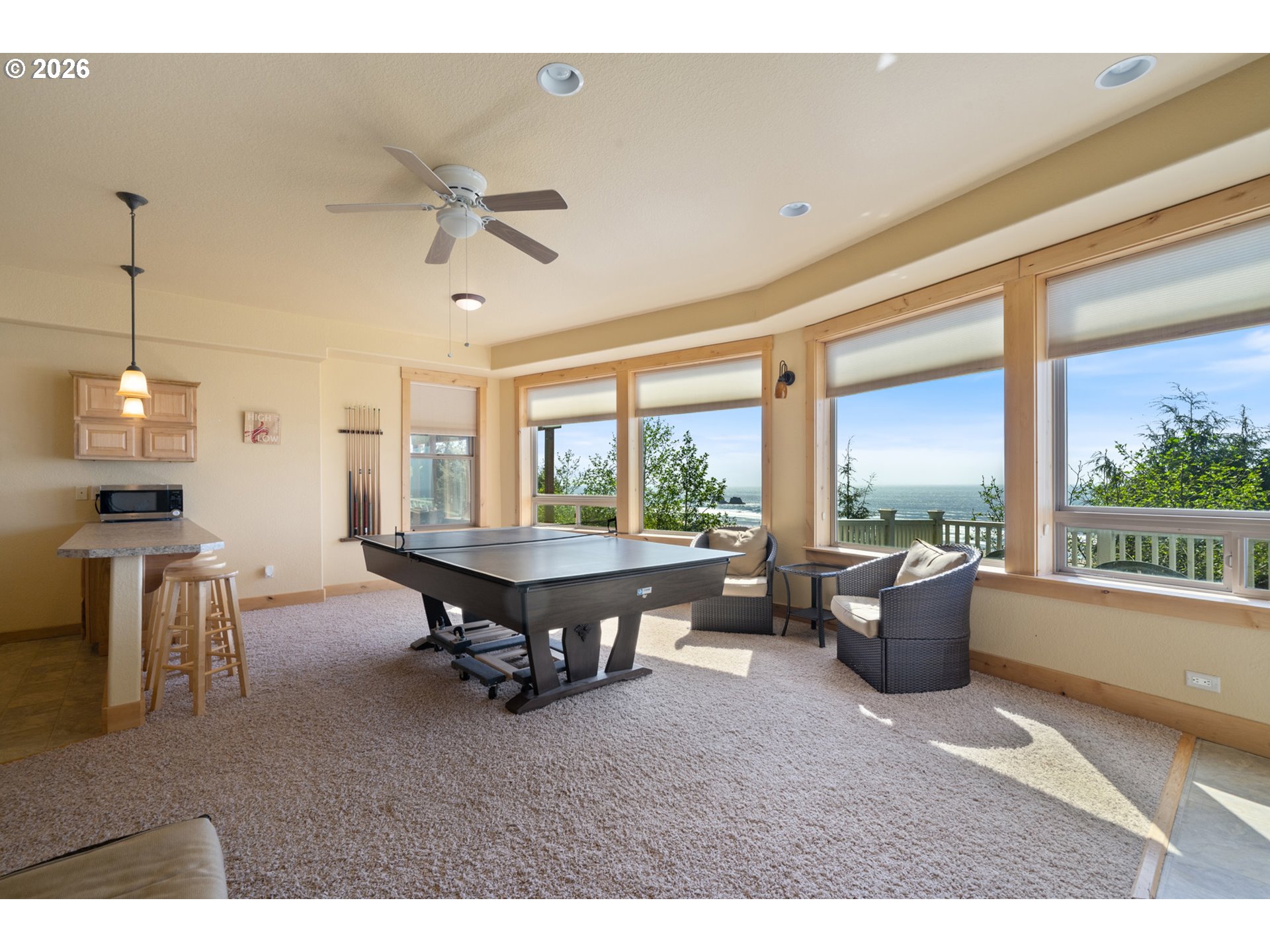 367 South Longview Loop Rockaway Beach, OR 97136 - Photo 35 of 48 a living room with furniture a window and a table