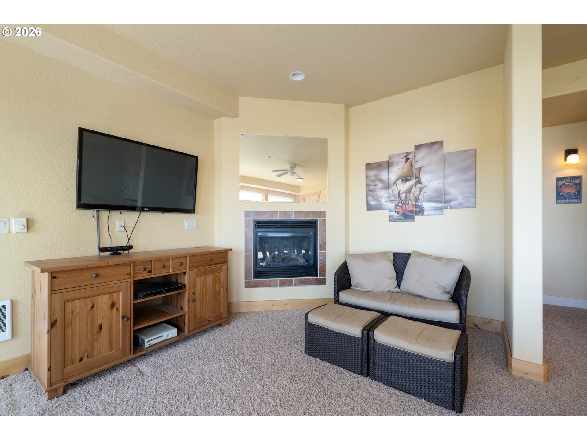 367 South Longview Loop Rockaway Beach, OR 97136 - Photo 37 of 48 a living room with furniture and a flat screen tv