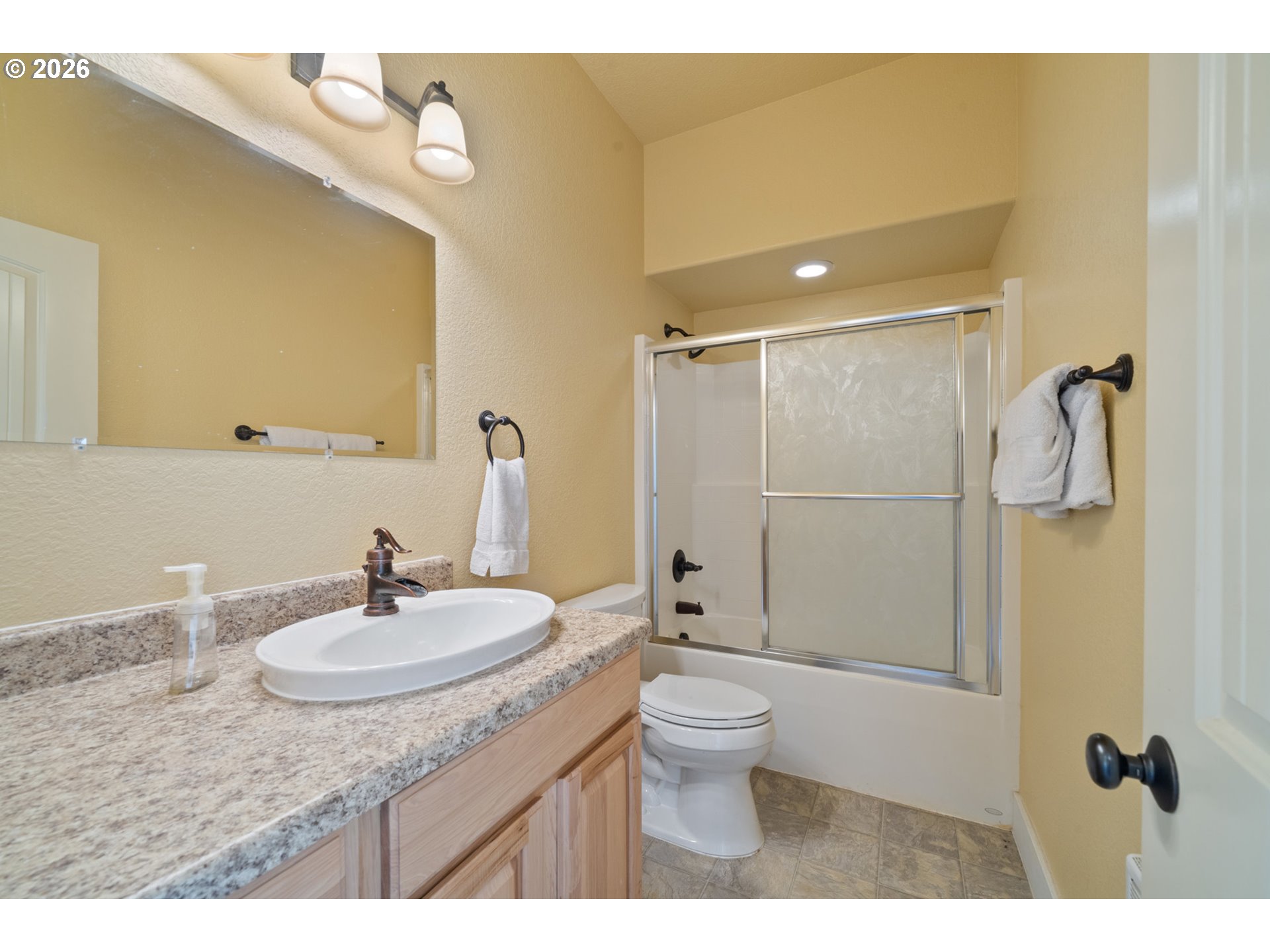 367 South Longview Loop Rockaway Beach, OR 97136 - Photo 40 of 48 a bathroom with a sink toilet a mirror and shower