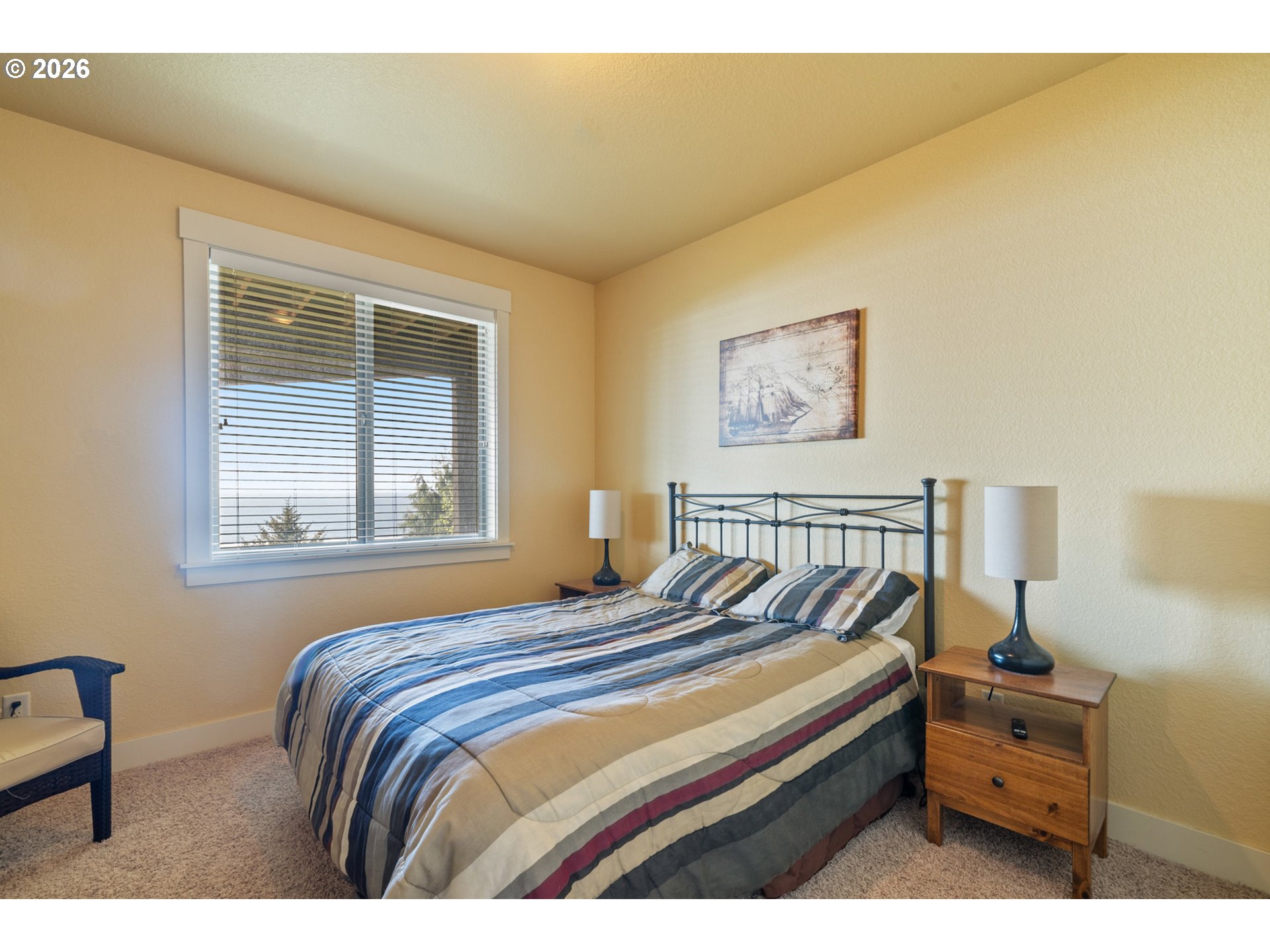 367 South Longview Loop Rockaway Beach, OR 97136 - Photo 43 of 48 a bedroom with a bed and a window