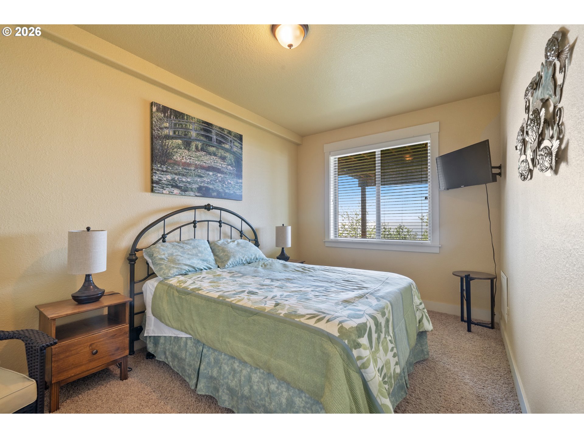 367 South Longview Loop Rockaway Beach, OR 97136 - Photo 46 of 48 a bedroom with a bed and a window