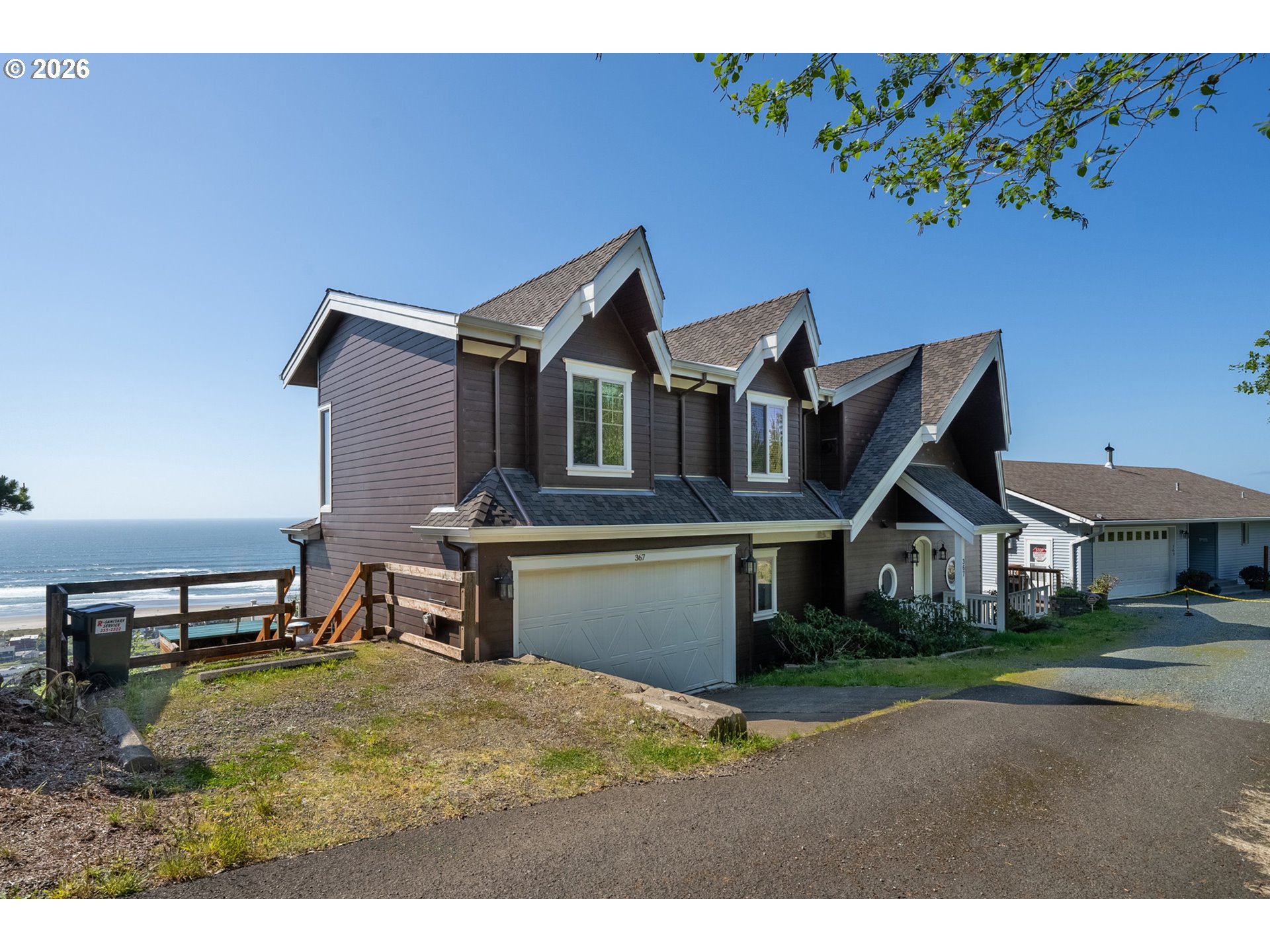 367 South Longview Loop Rockaway Beach, OR 97136 - Photo 5 of 48 a front view of a house with a yard