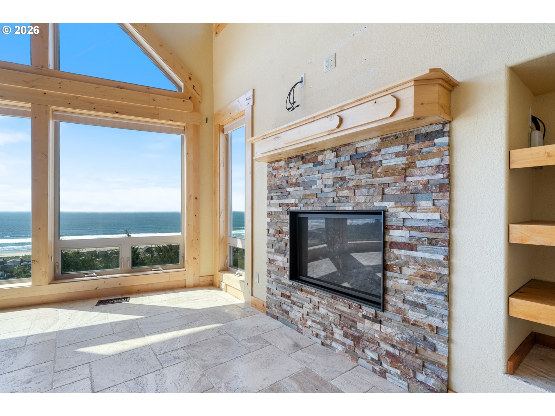 367 South Longview Loop Rockaway Beach, OR 97136 - Photo 9 of 48 a front view of a fireplace with wooden floor