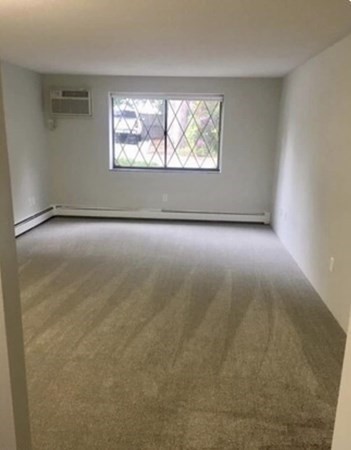 12 Melrose Terrace, Unit 13 Wakefield, MA 01880 - Photo 4 of 12 an empty room with windows