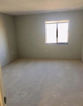 12 Melrose Terrace, Unit 13 Wakefield, MA 01880 - Photo 6 of 12 an empty room with a window