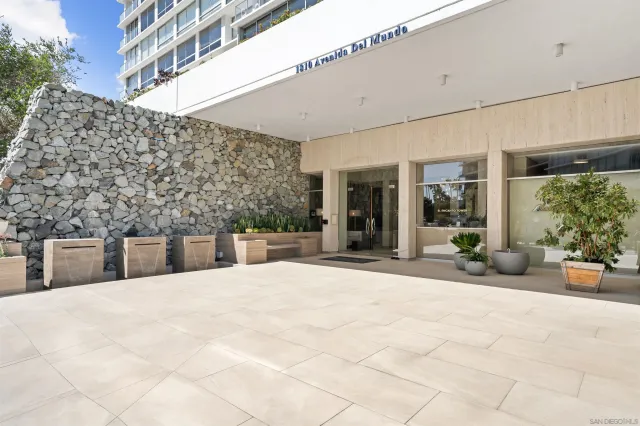 a view of a terrace with chairs and potted plants