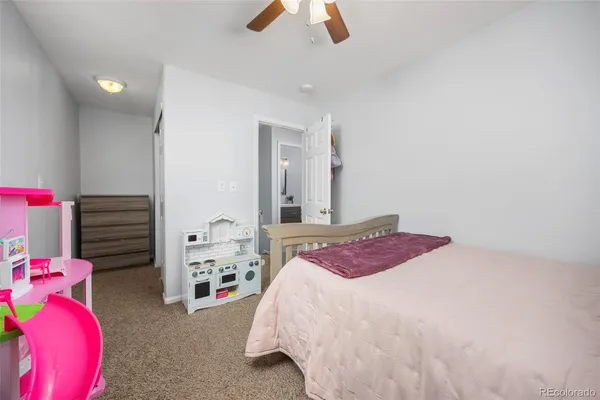 a bedroom with a bed and closet