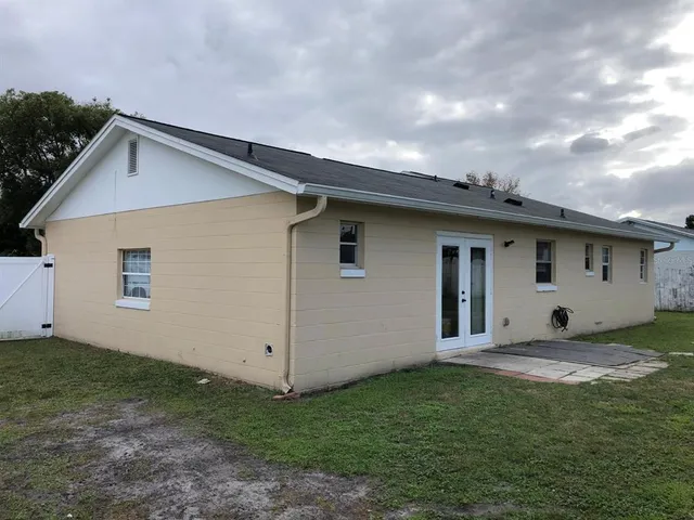 a view of a backyard of the house