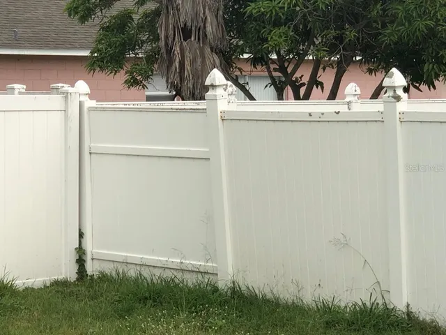 a view of room with window and wooden floor