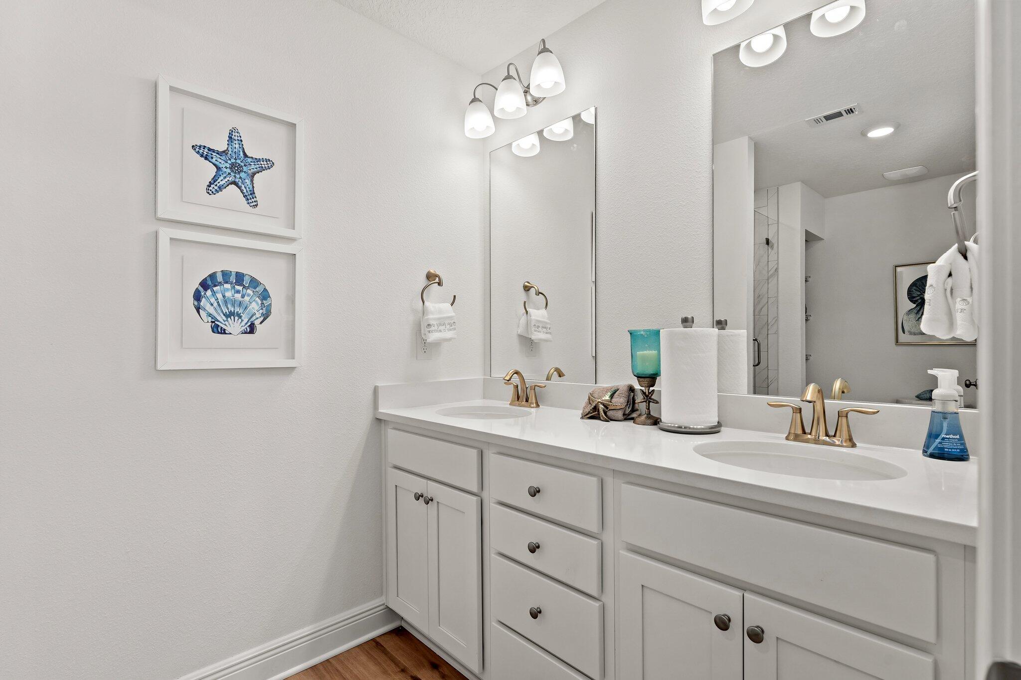 2 Renea Cove, Unit LOT 009 Destin, FL 32541 - Photo 23 of 30 a bathroom with a double vanity sink and a mirror