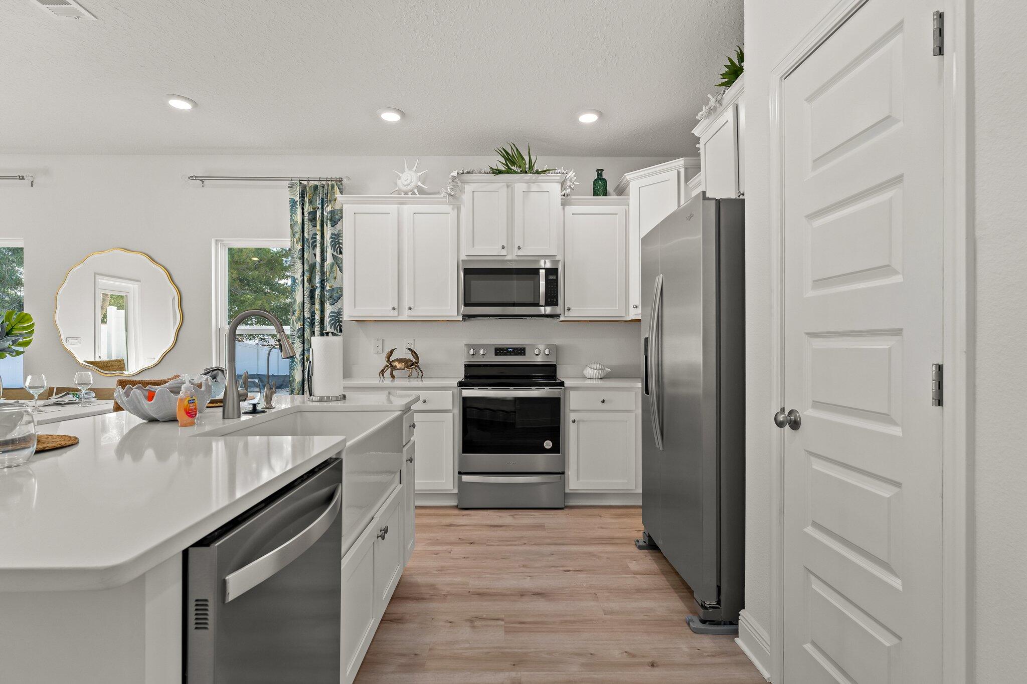 2 Renea Cove, Unit LOT 009 Destin, FL 32541 - Photo 6 of 30 a kitchen with a sink cabinets and stainless steel appliances