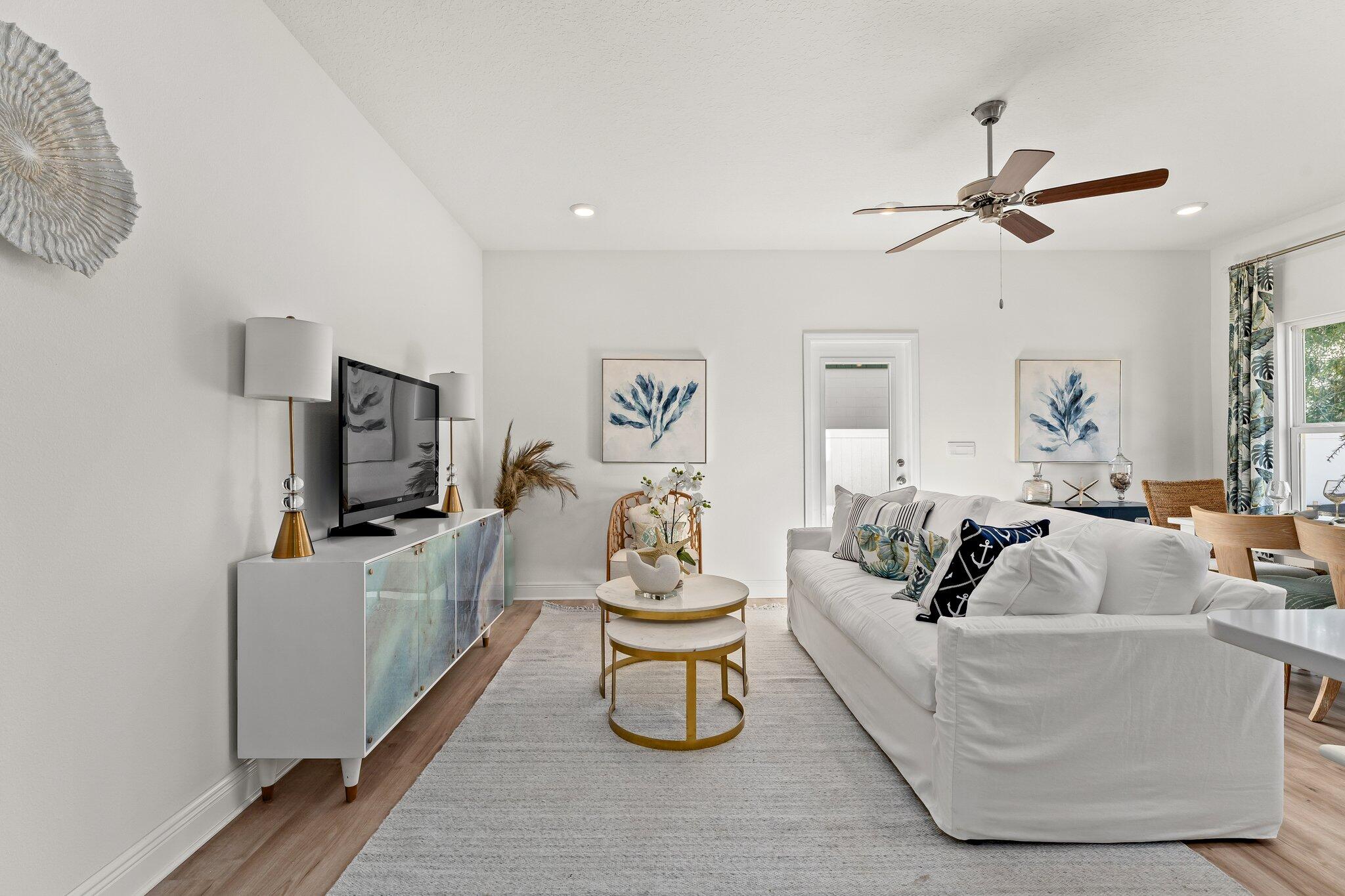 2 Renea Cove, Unit LOT 009 Destin, FL 32541 - Photo 10 of 30 a living room with furniture and a flat screen tv