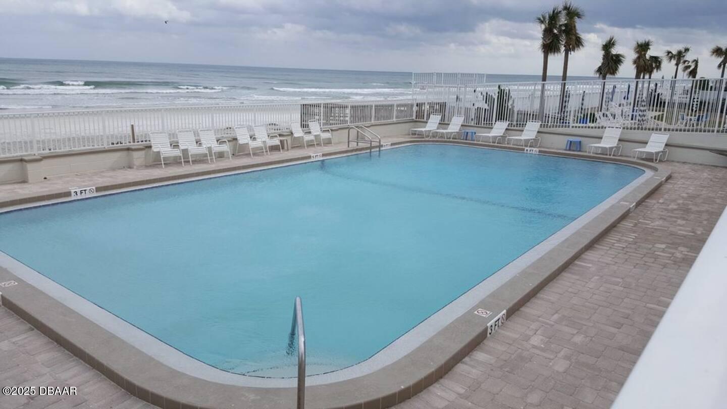 3727 South Atlantic Avenue, Unit 4030 Daytona Beach, FL 32118 - Photo 7 of 8 a floor with a table and chairs in it