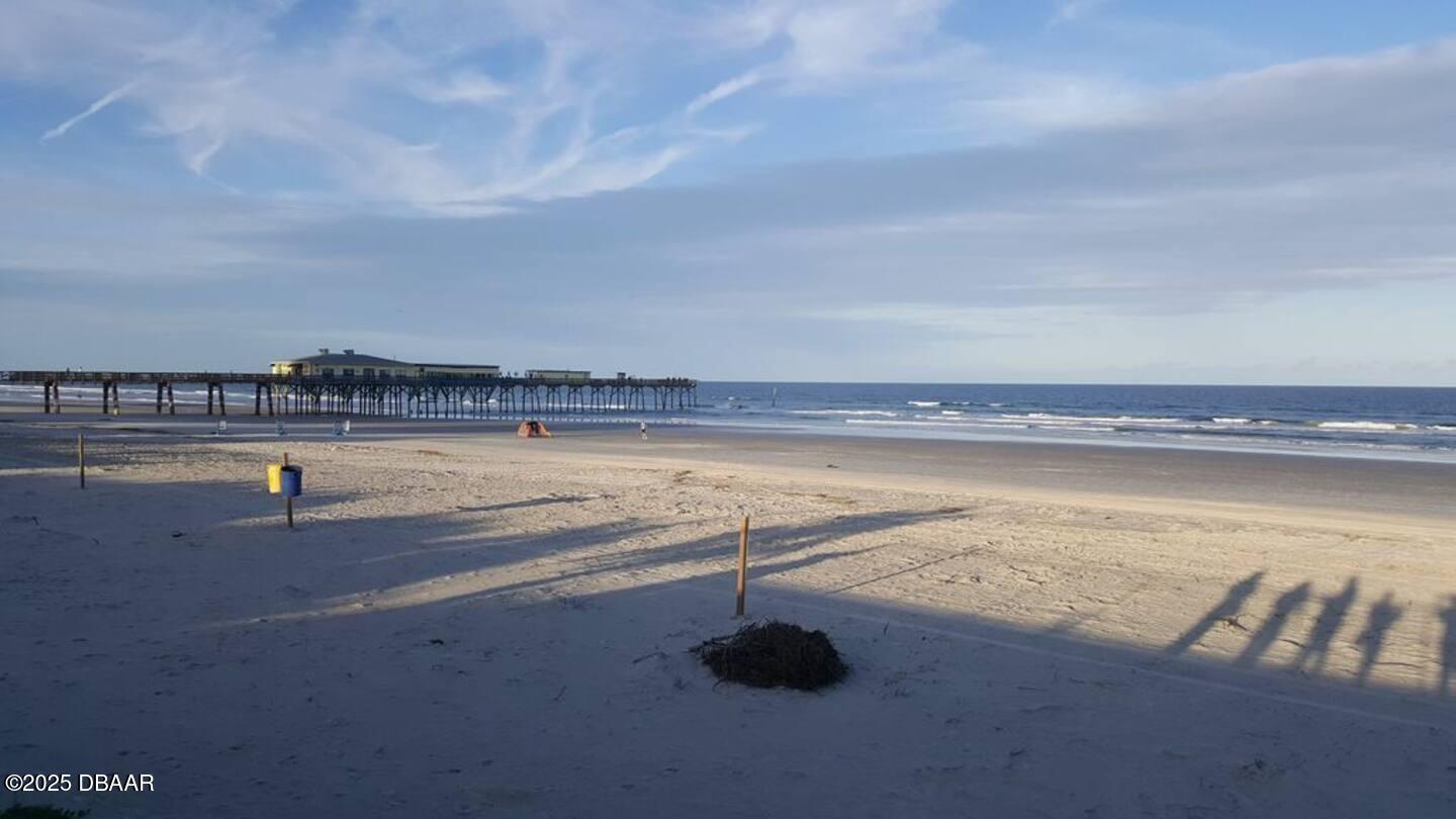 3727 South Atlantic Avenue, Unit 4030 Daytona Beach, FL 32118 - Photo 8 of 8 a view of a swimming pool and an outdoor seating