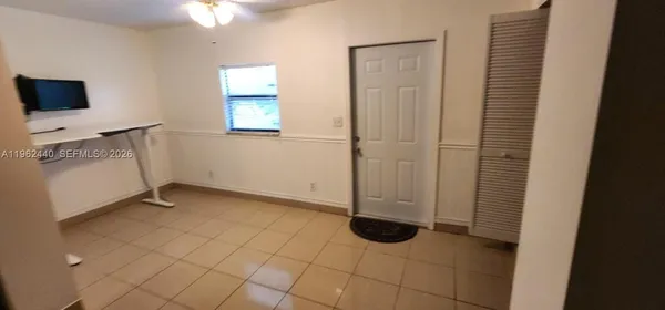 a view of a storage & utility room with a window