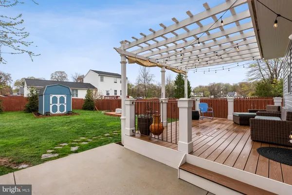 a view of a house with a yard table and chairs