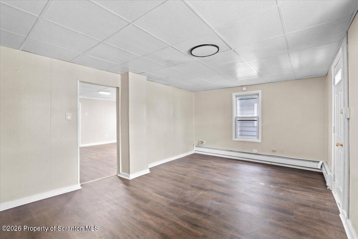 132 Penn Avenue Exeter, PA 18643 - Photo 22 of 44 an empty room with wooden floor and windows