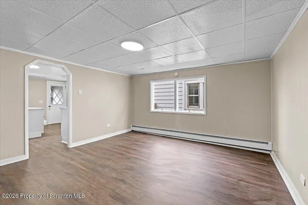 a view of entryway with wooden floor