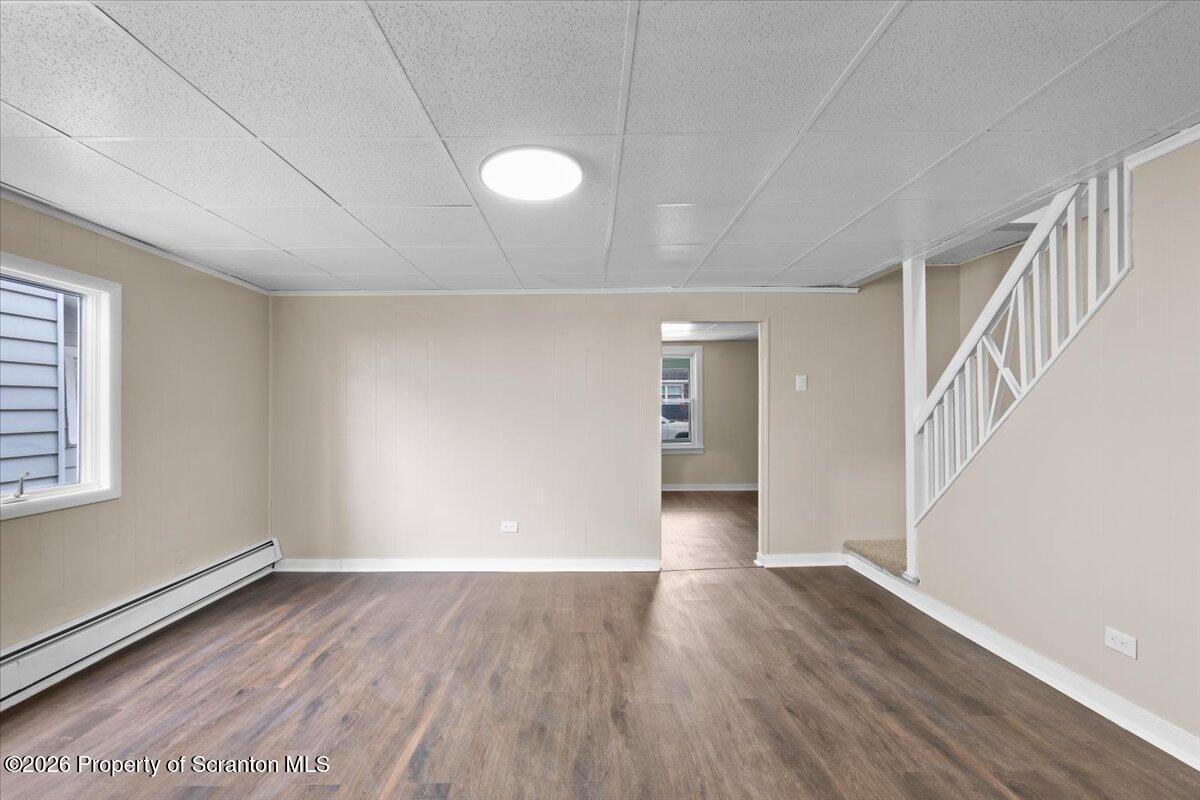 132 Penn Avenue Exeter, PA 18643 - Photo 25 of 44 a view of an empty room with wooden floor and a window