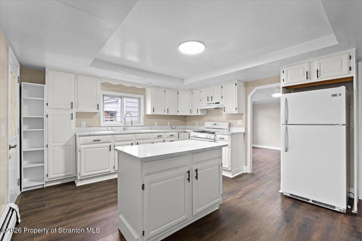 132 Penn Avenue Exeter, PA 18643 - Photo 26 of 44 a kitchen with a refrigerator sink and cabinets