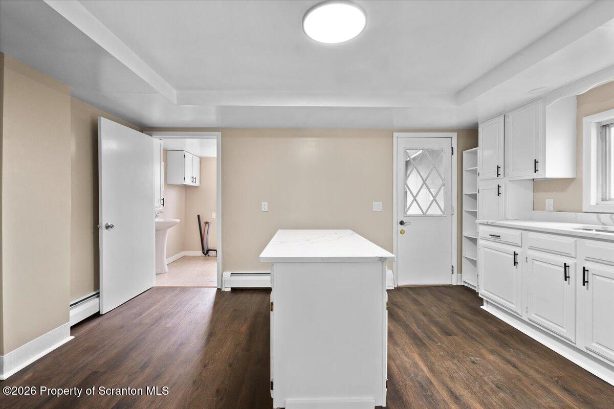 132 Penn Avenue Exeter, PA 18643 - Photo 28 of 44 a kitchen with a refrigerator a sink and wooden floor