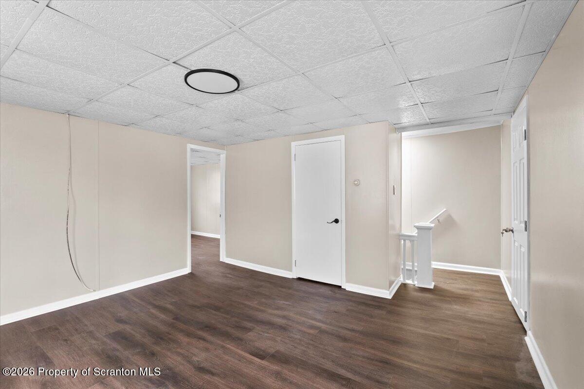 132 Penn Avenue Exeter, PA 18643 - Photo 31 of 44 a view of an empty room with wooden floor and a window