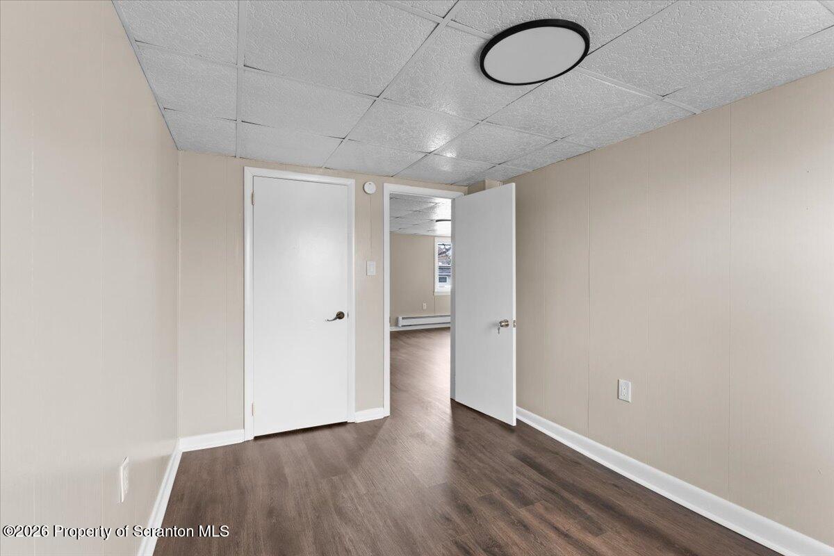 132 Penn Avenue Exeter, PA 18643 - Photo 35 of 44 a view of a room with wooden floor and glass doors