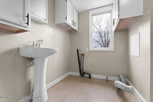 a white toilet sitting in a bathroom