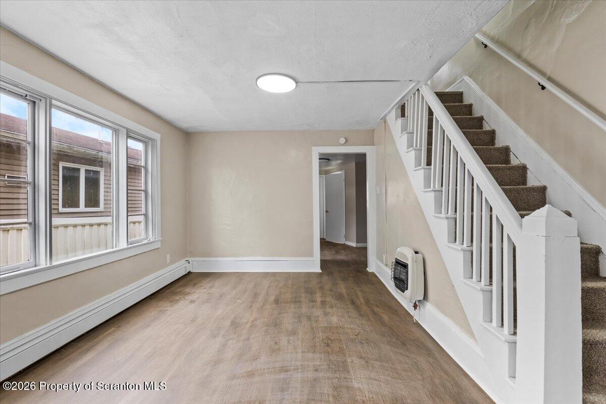 132 Penn Avenue Exeter, PA 18643 - Photo 4 of 44 wooden floor in an empty room with a window