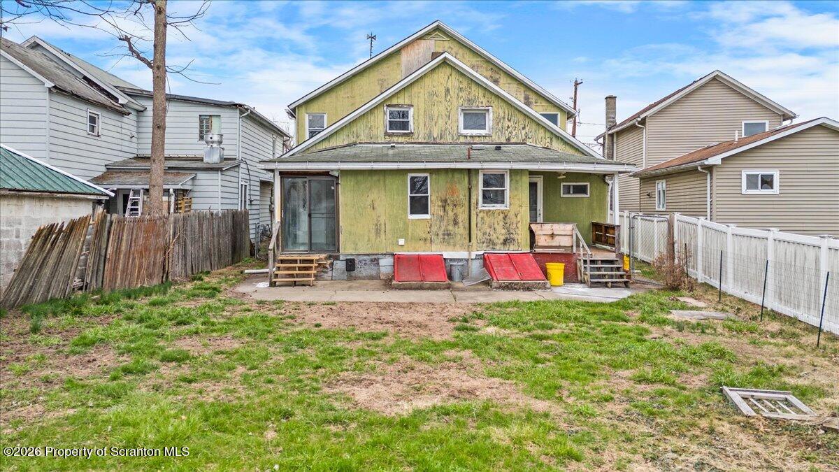132 Penn Avenue Exeter, PA 18643 - Photo 41 of 44 a view of a house with a yard and lawn chairs