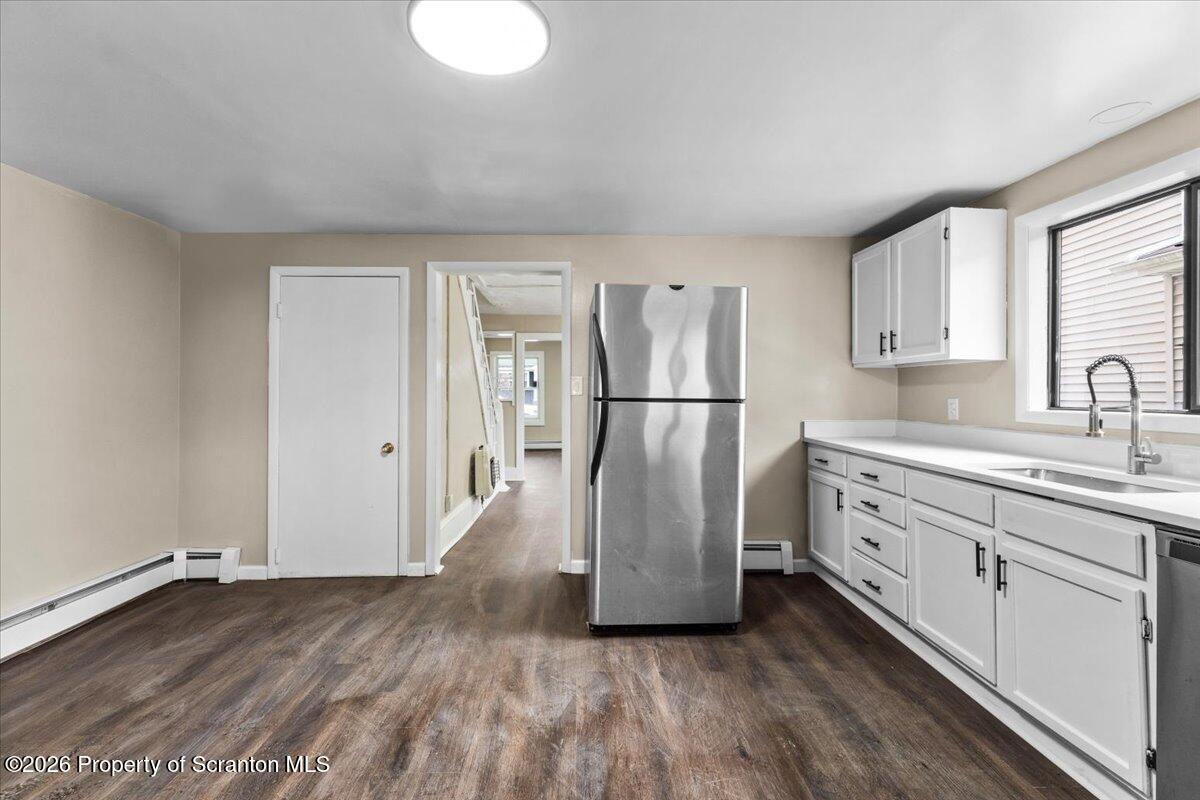 132 Penn Avenue Exeter, PA 18643 - Photo 9 of 44 a kitchen with cabinets and stainless steel appliances