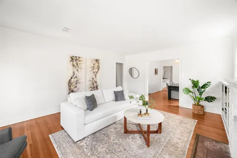 a living room with furniture and a rug
