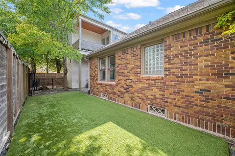 a brick house with a yard