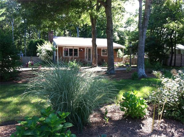 32 Baird Centerville, MA 02632 - Photo 1 of 14 a view of a house with a yard and sitting area