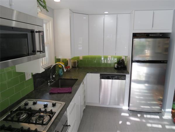 32 Baird Centerville, MA 02632 - Photo 3 of 14 a kitchen with a stove a faucet and a refrigerator