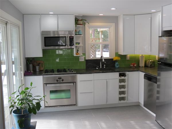 32 Baird Centerville, MA 02632 - Photo 5 of 14 a kitchen with stainless steel appliances white cabinets and a stove
